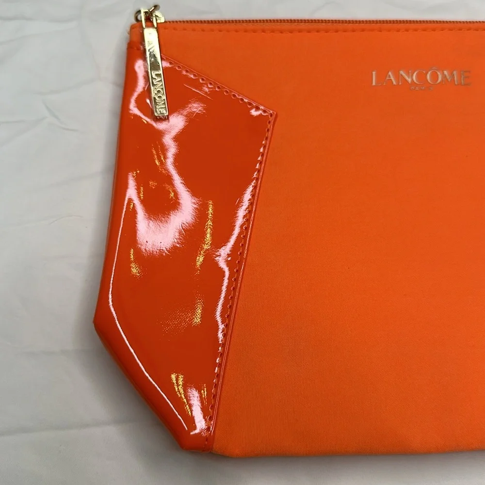 BEAND NEW! Vibrant Orange Cosmetic Bag with Glossy Finish and Zipper Closure.